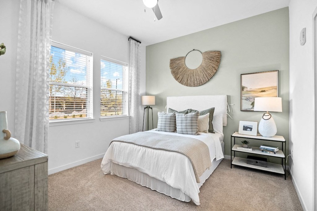Canopy-Park-Pelham-PG-10 a bedroom with a bed and two windows
