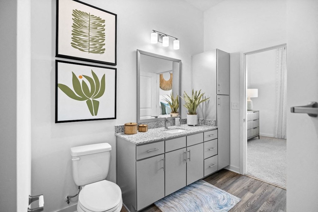 a bathroom with a toilet and a sink