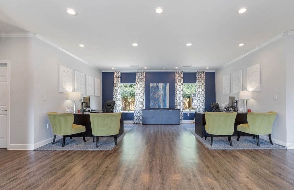 the leasing office with two desks and four chairs in the clubhouse at The Onyx Hoover
