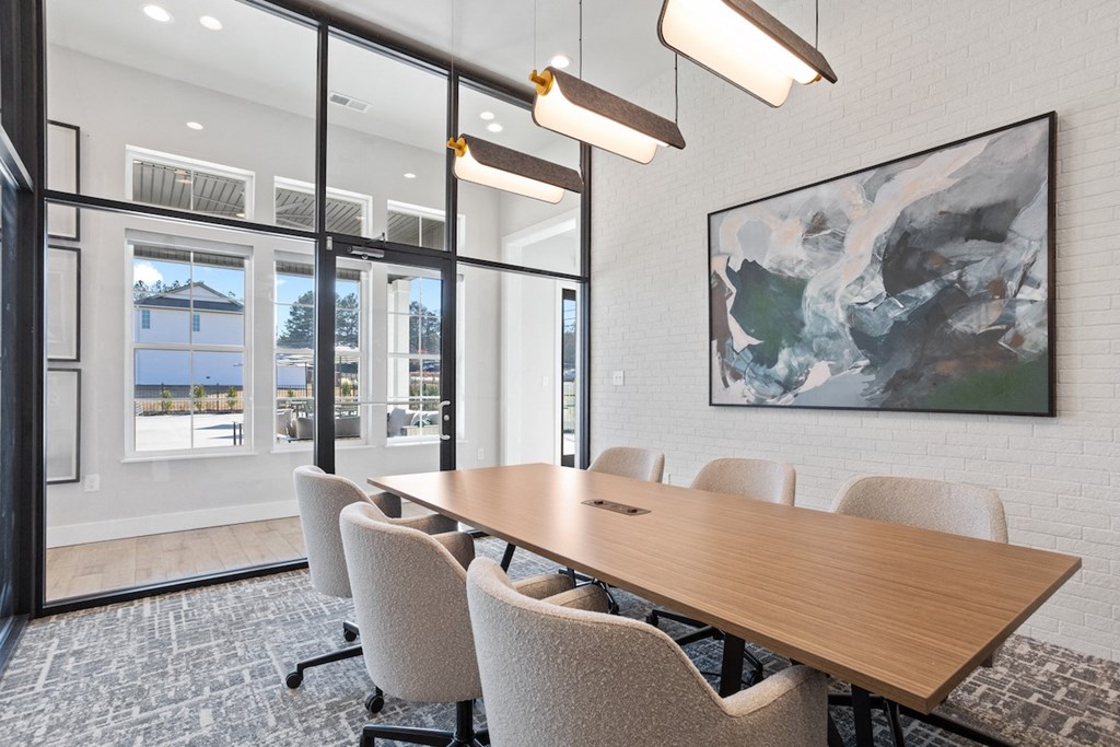 the spacious glassed in conference room with a large conference table and chairs in Sanctuary at Indian Creek Clubhouse
