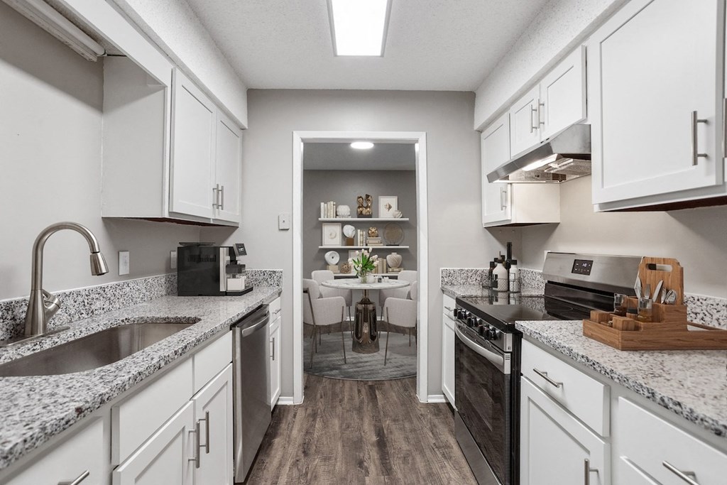 an open kitchen and dining room with a table in the distance