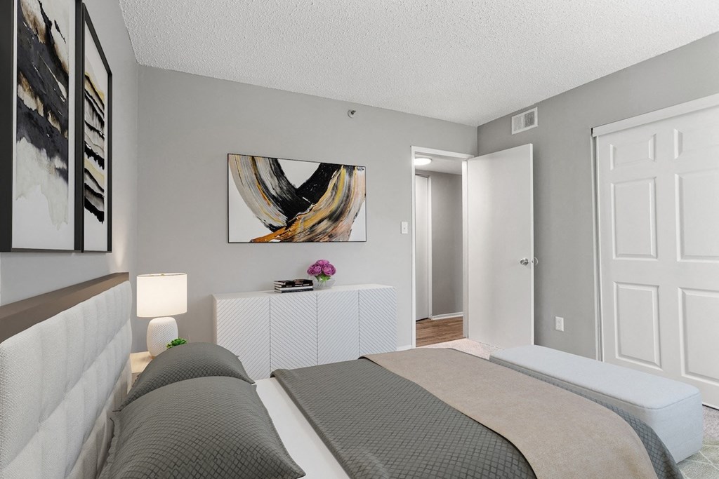 a bedroom with a bed and a closet