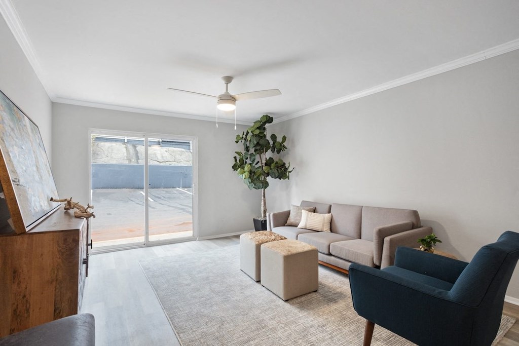an apartment living area with model furnishings and lots of natural light at Mountainside Apartments
