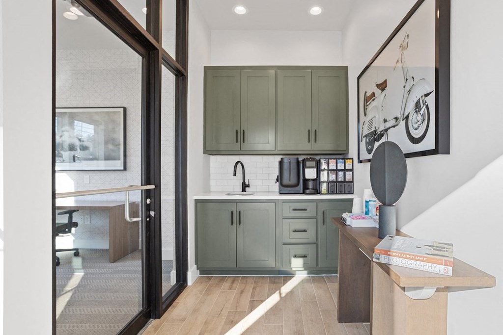 a small kitchenette with a sink and deluxe Coffee Café in the clubhouse at Sanctuary at Indian Creek