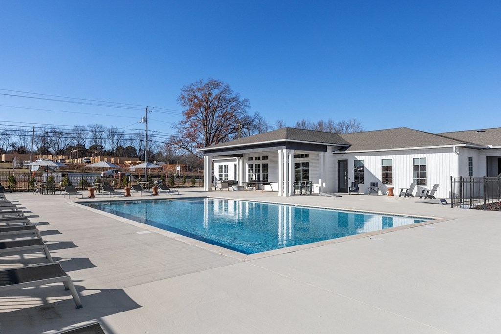 the swimming pool and sundeck behind the clubhouse at Sanctuary at Indian Creek Rental Homes in North Alabama