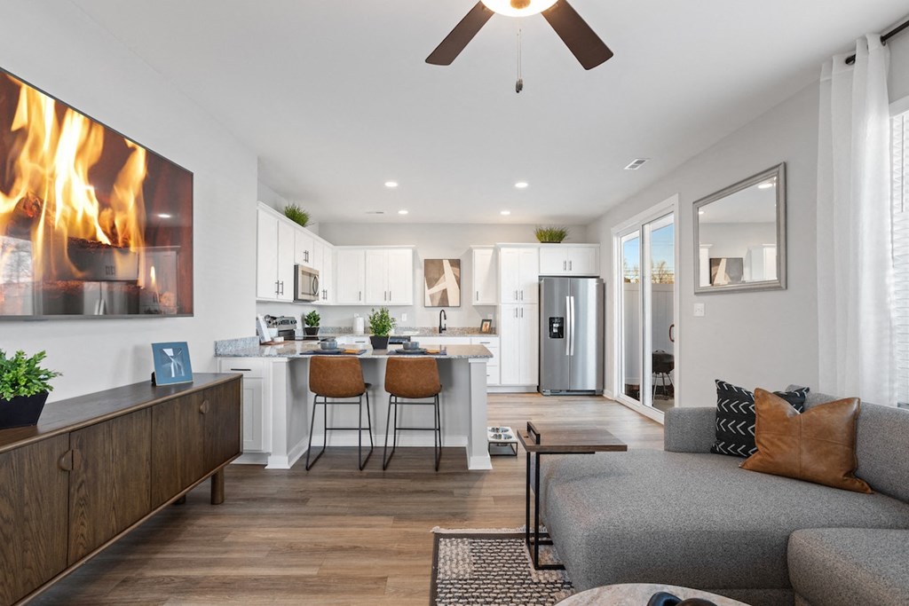 an open concept kitchen and living room in a home at Sanctuary at Indian Creek homes for rent near Cummings Research Park