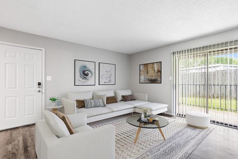 a living room with a white couch and a table