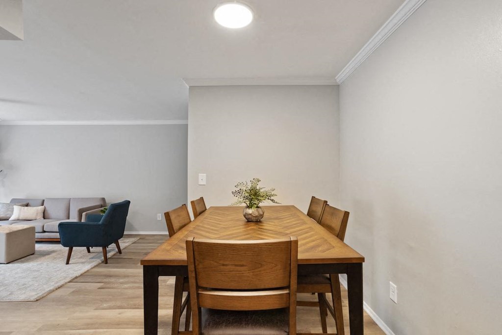 a dining set in the dining area in an apartment home for rent at Mountainside Apartments