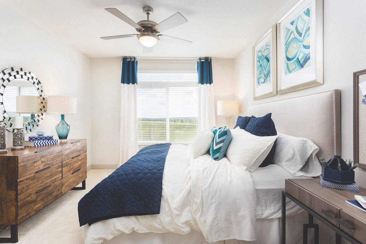 Spacious furnished bedroom with ceiling fan  at LandonHouse Apartments in Lake Nona, Orlando, FL 32827