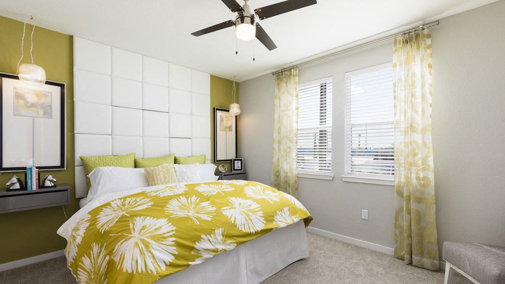 model bedroom with designer fan and large windows