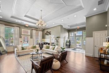 Resident clubhouse with seating and entertainment center at Centerville Manor Apartments, Virginia Beach, 23464