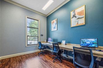 Business center with computers and chairs at Centerville Manor Apartments, Virginia Beach