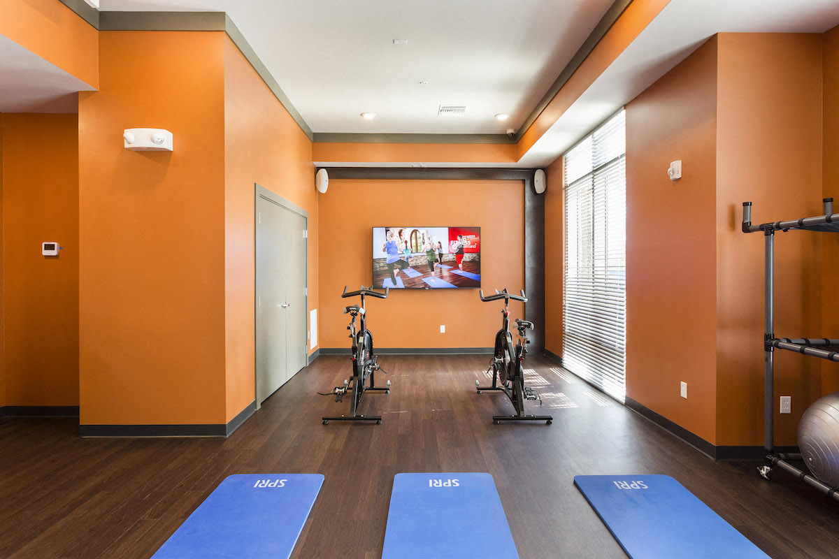 Cardio center with yoga mats and spin bikes  at LandonHouse in Lake Nona