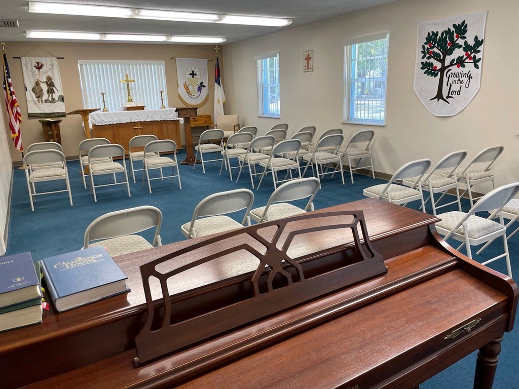 Large chapel with plenty of seating and piano