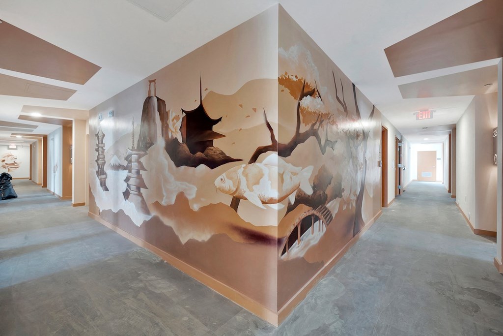 large mural at The Citizen Birmingham of pagodas and fish flying in the air