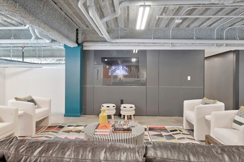 upper level lounge at The Citizen Birmingham with seating and a TV