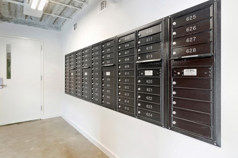 large bank of usps mail boxes