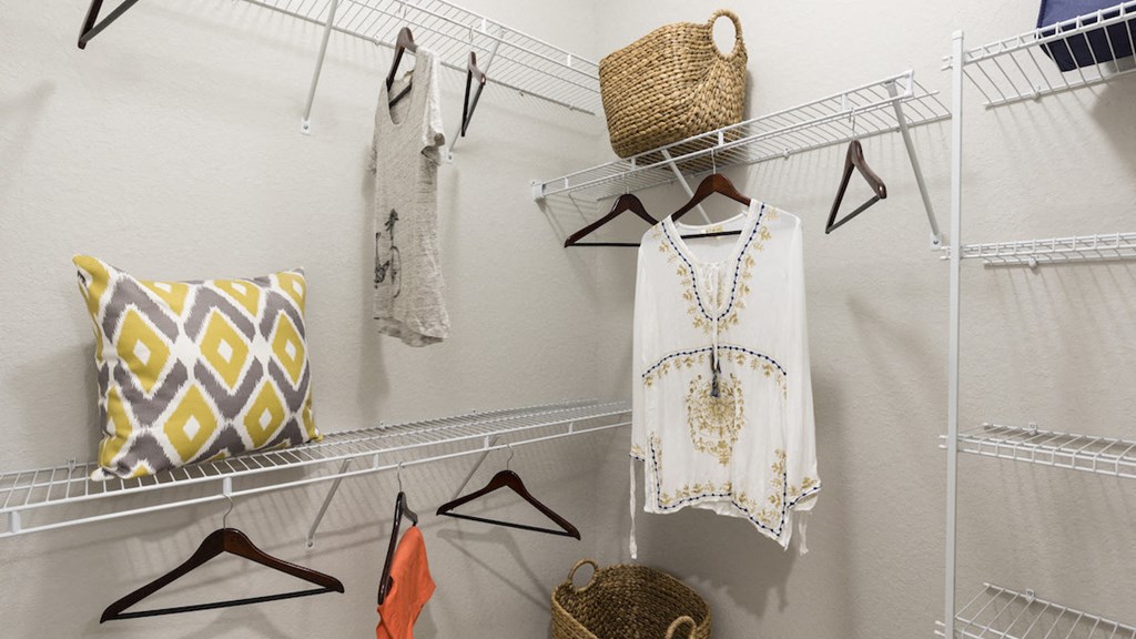 oversized closet with built in shelving and example storage