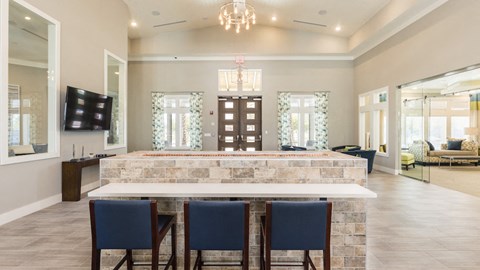 a large kitchen with a table and chairs