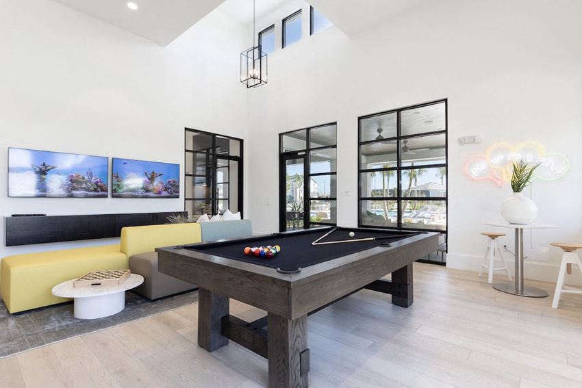 Concorde-billiards a pool table and sofa in Lake Nona Concorde clubhouse