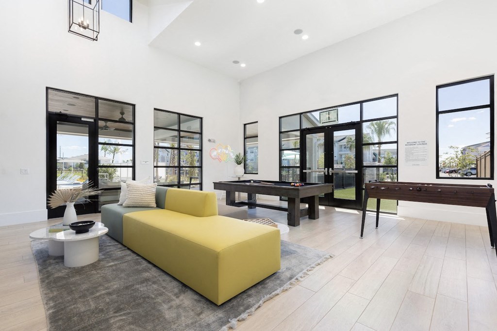 game area with billiards and fooseball in clubhouse at Lake Nona Concorde