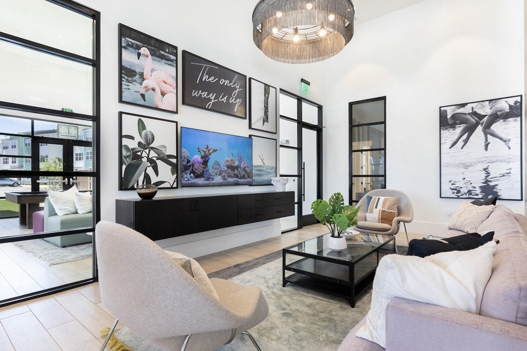 relaxing lounge with ample seating, a tv, and decor at Lake Nona Concorde
