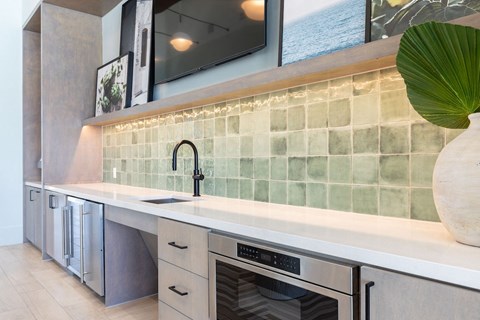 a kitchen with a sink and a dishwasher in a house