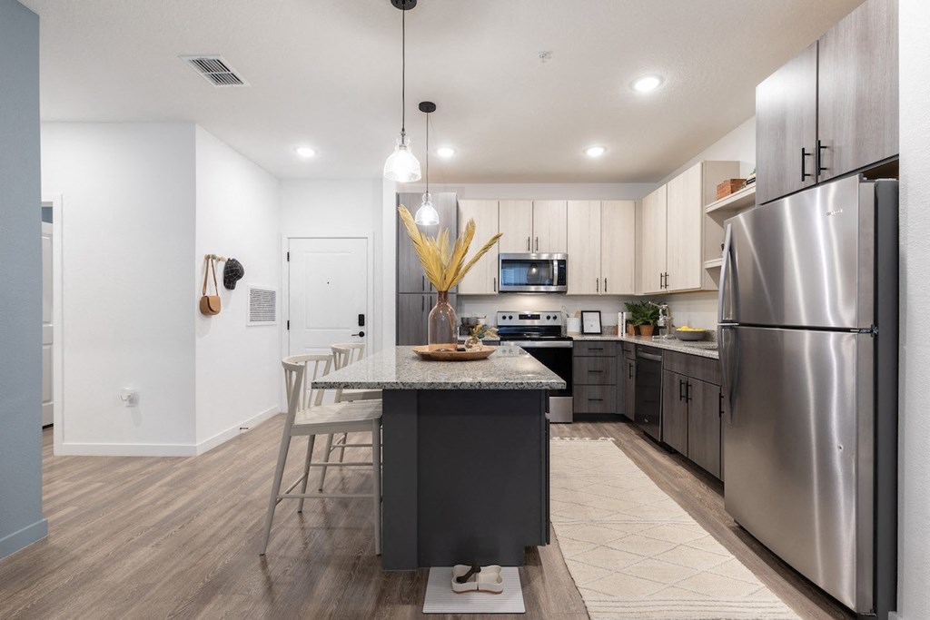 Kitchen with stainless steel appliances at Lake Nona Concorde