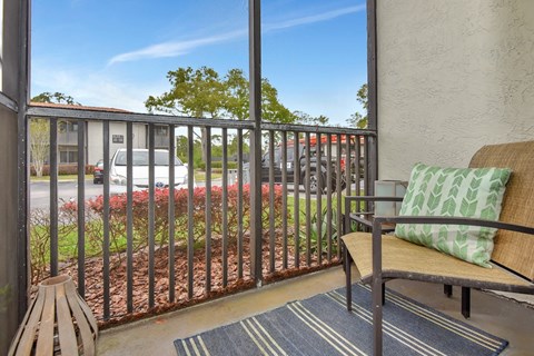a residential private screened balcony at The Oasis Daytona