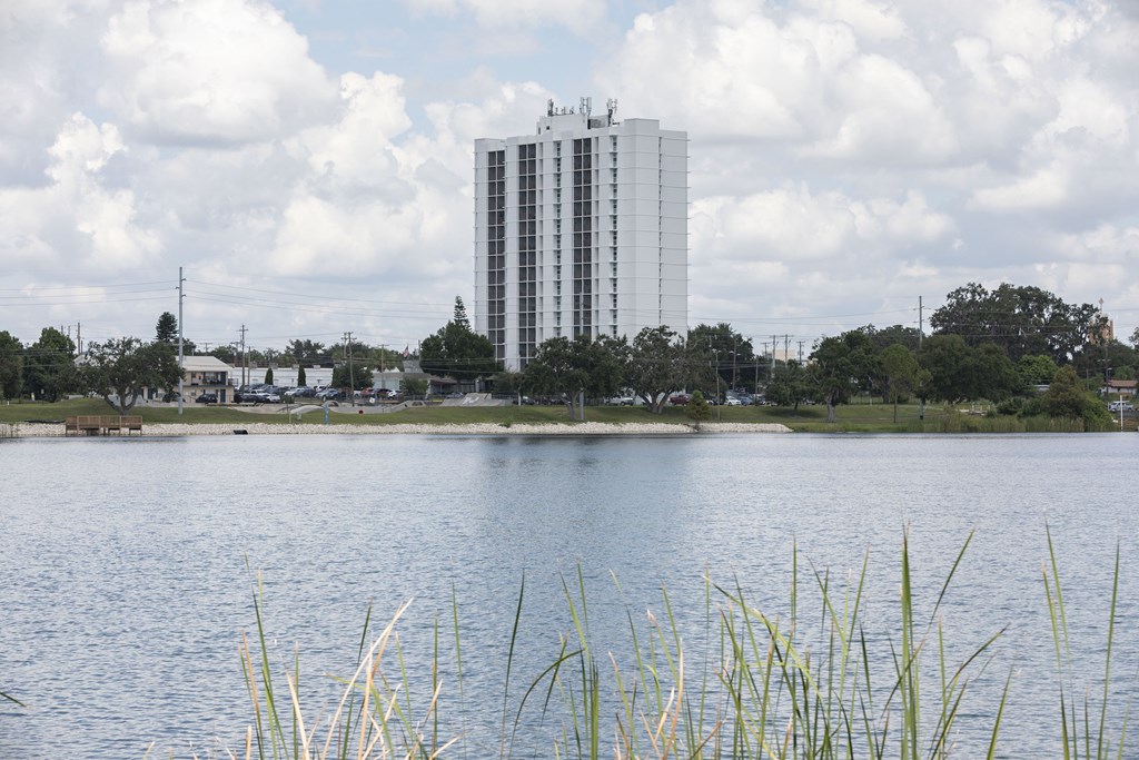 A large body of water with a building in the background.
