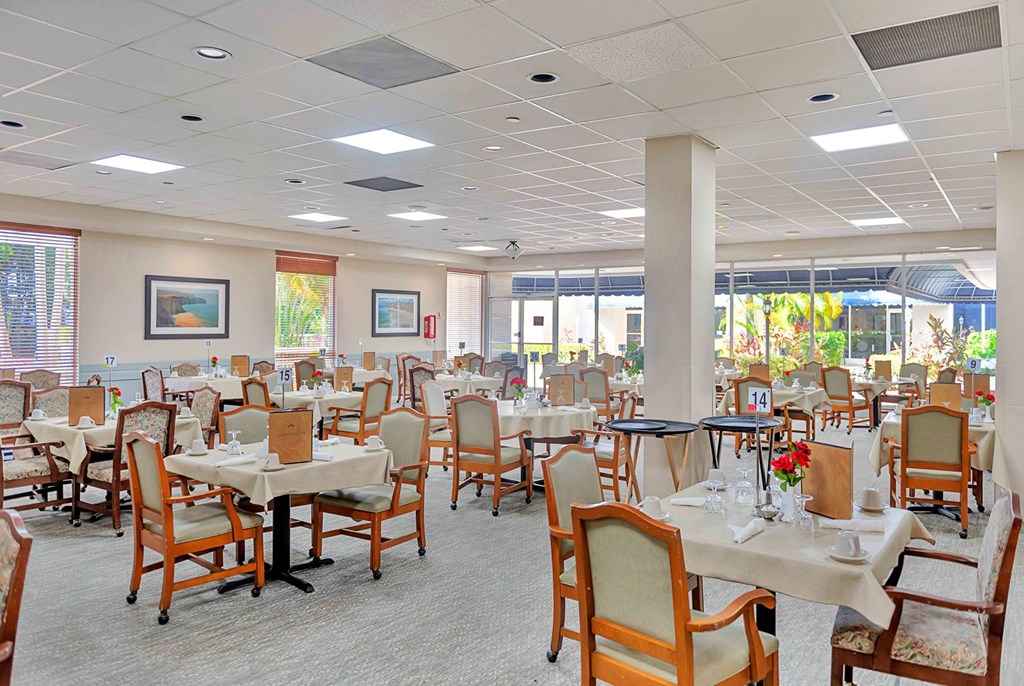 a dining room with tables and chairs in a restaurant