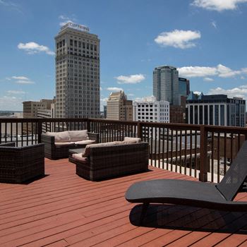 rooftop amenity deck with furniture and stunning city view at Goodall-Brown Lofts, Birmingham, AL
