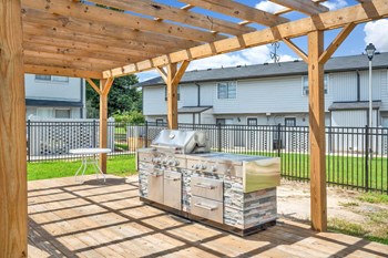 Goshen-Estates-Gallery-7 Large grilling station under pergola at Goshen Estates Apartments in Augusta, GA - Photo Gallery 3