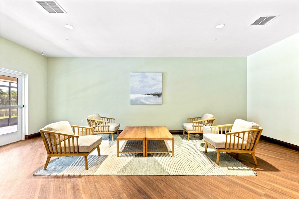 a conference room with a wooden table and chairs