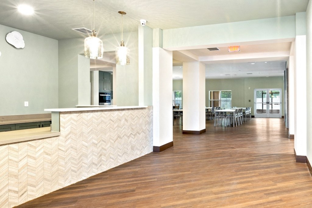 a view of a lobby with a reception desk and a dining room