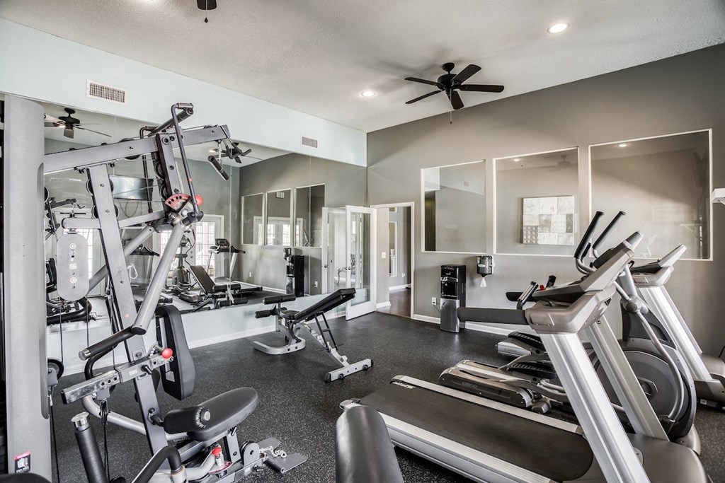 the modern fitness center with ample work out equipment at Trails at Alabaster Apartments