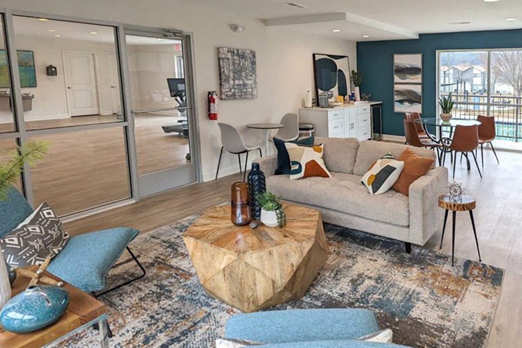 Clubhouse with comfortable seating and office  at Huntsville Landing Apartments, Alabama, 35806