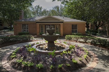 Large planter full of plants in courtyard at Hampton House Apartments in Jackson, MS - Photo Gallery 8