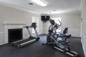 fitness center with cardio equipment and television - Photo Gallery 14