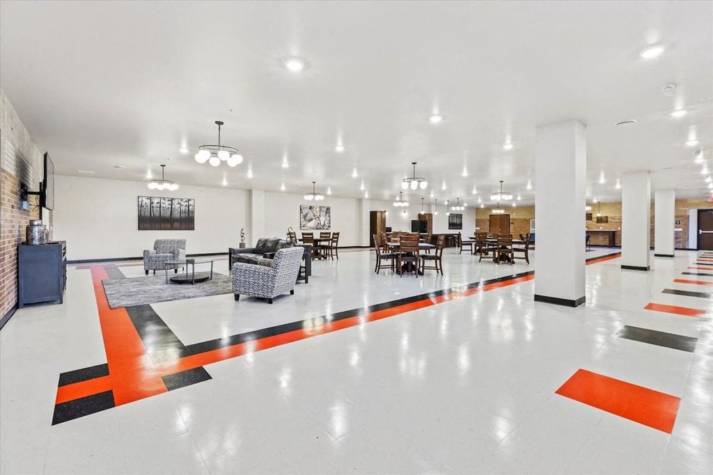 Horicon School's large community room with many chairs, tables, and a kitchenette