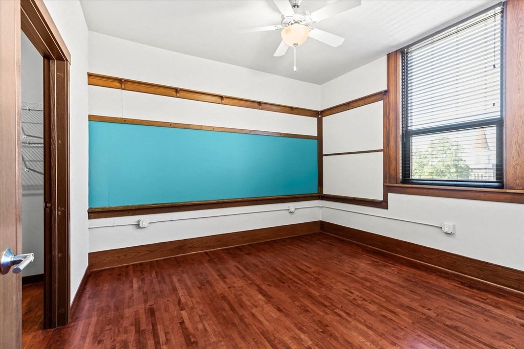 a large room with a wall chalkboard in an apartment at historic Horicon School