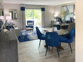TheView-7 Large living room with hardwood-style flooring and large sliding glass doors - Photo Gallery 5