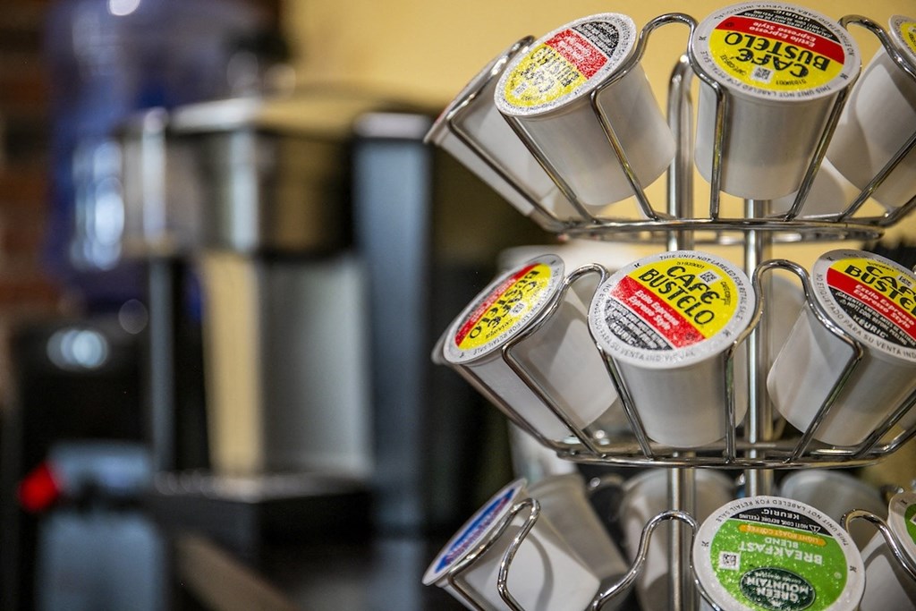 a rack of coffee mugs in a coffee shop