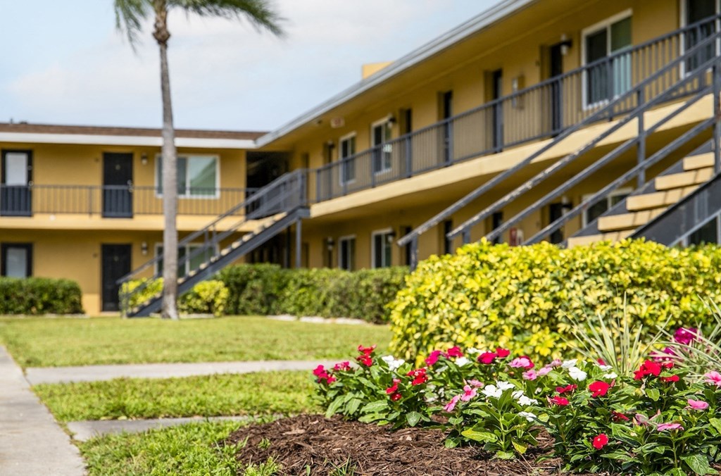 a picture of a building with flowers in front of it