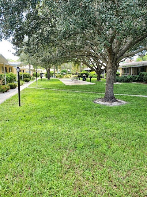 beautifully landscaped grounds with street lamps