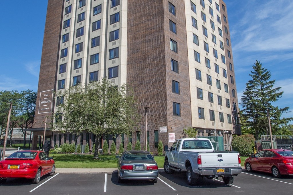 the exterior of Piotr Stadnitski Gardens with parking lot and lush landscaping