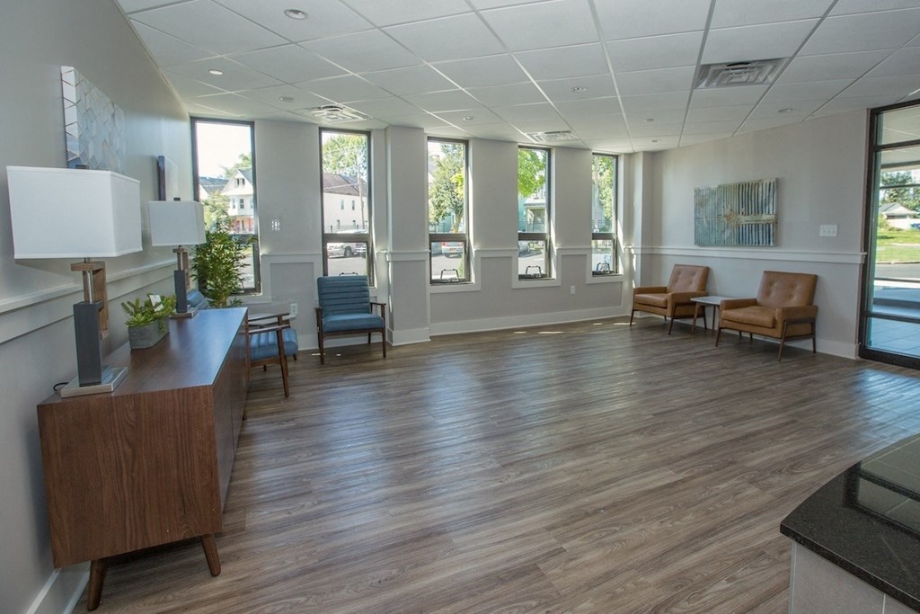 the lobby at Piotr Stadnitski Gardens with seating areas and large windows
