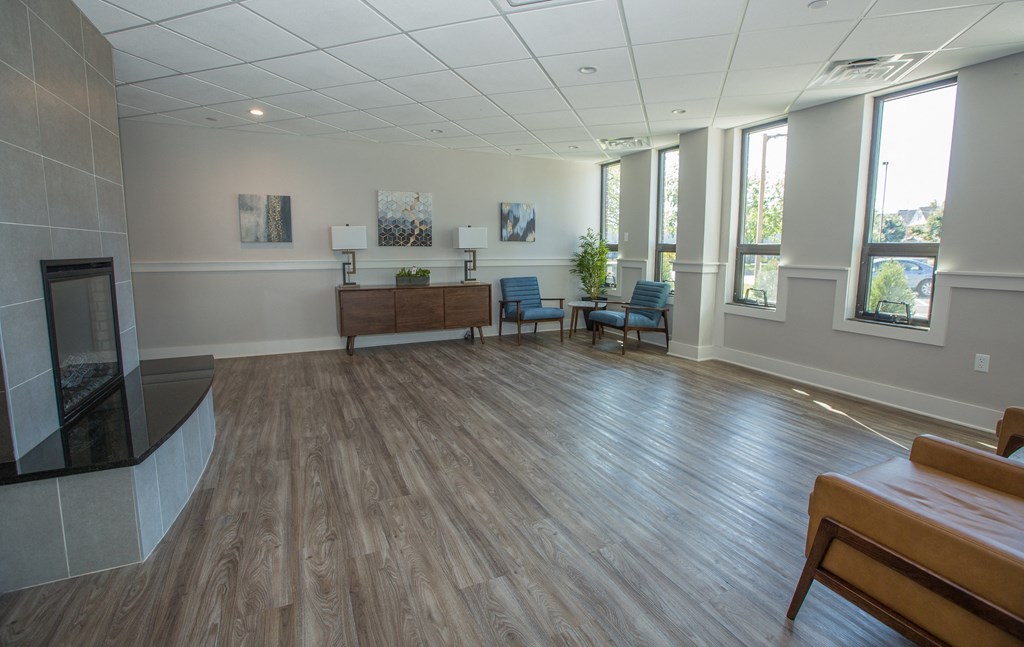 Piotr Stadnitski Gardens' ground floor lobby with seating areas and a fireplace