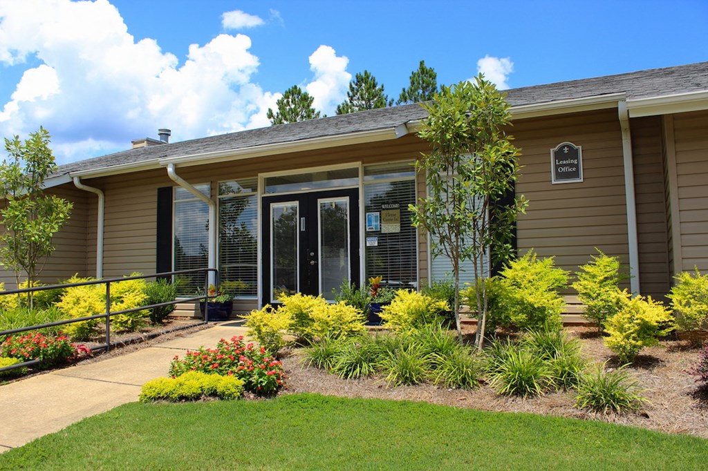leasing office with wide paved pathway to door