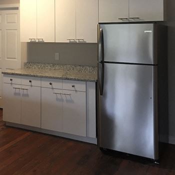 updated kitchen with stainless steel and granite at Goodall-Brown Lofts, Birmingham, AL